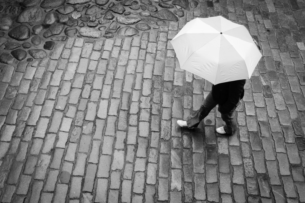 Woman With Umbrella In Rain