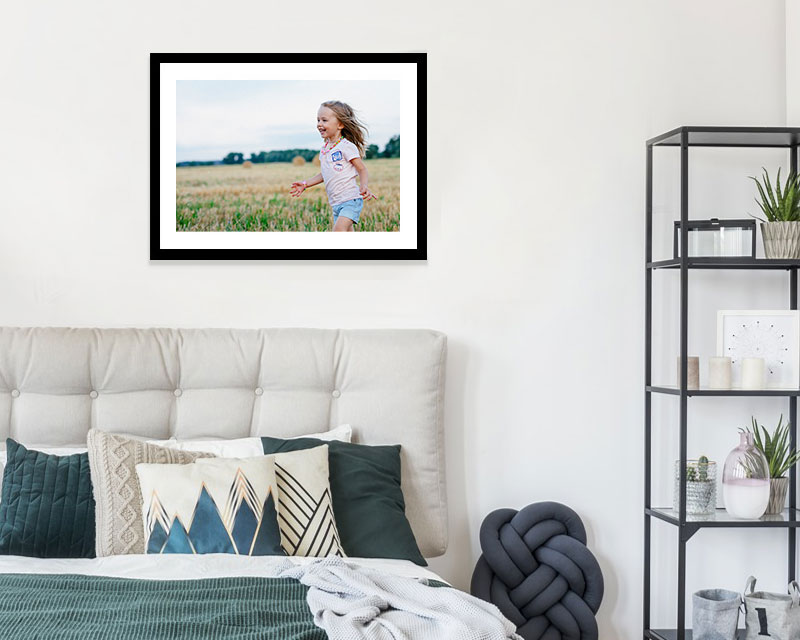 framed print hanging on a wall